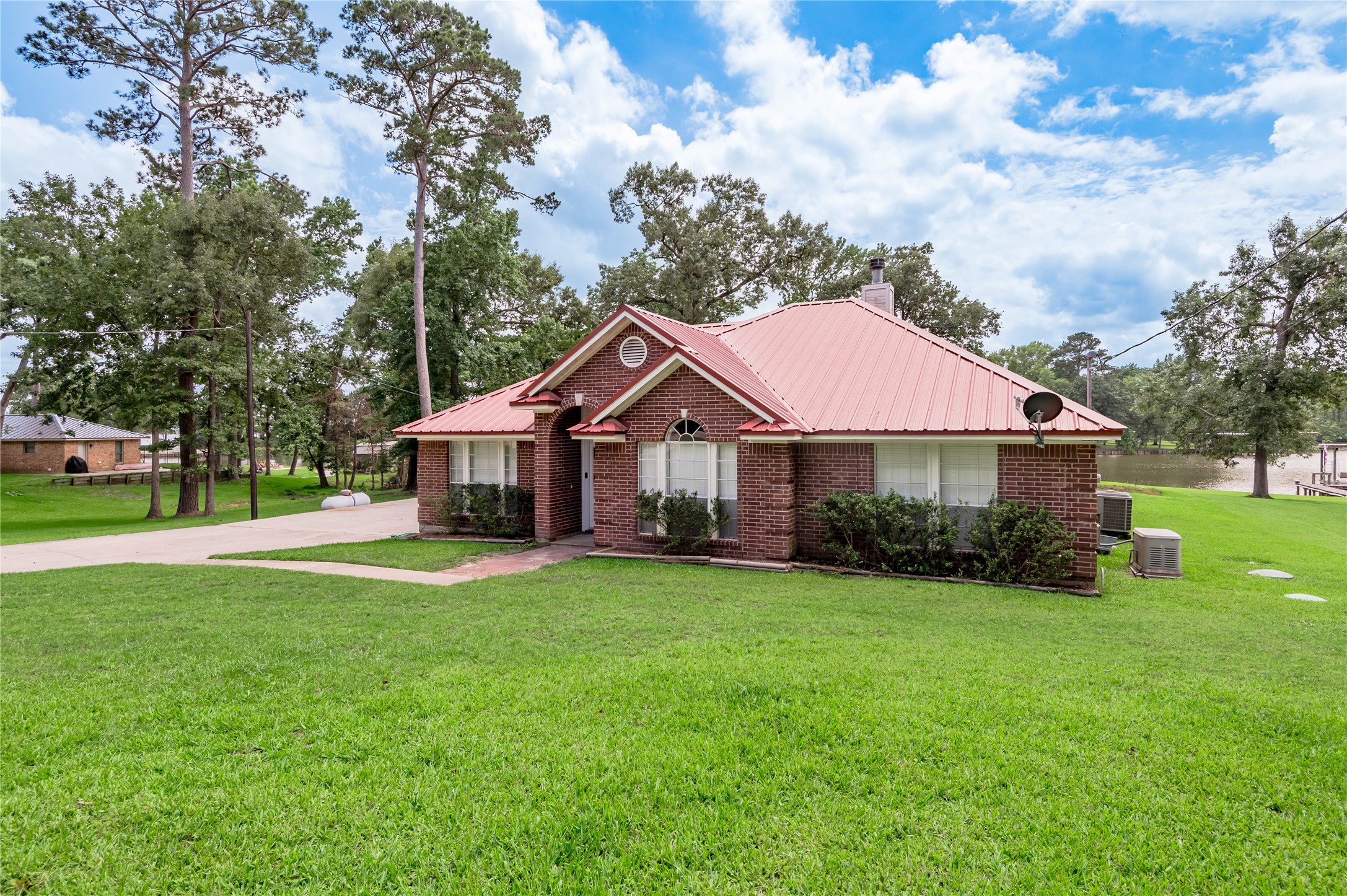324 Red Oak Lane Trinity, TX 75862 - Photo 44 of 49 a front view of a house with garden