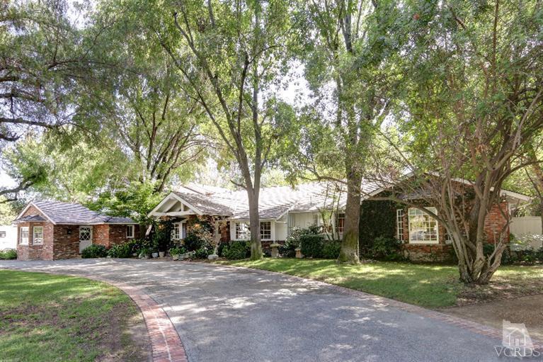 24024 Long Valley Road Hidden Hills, CA 91302 - Photo 1 of 1 a front view of a house with a garden