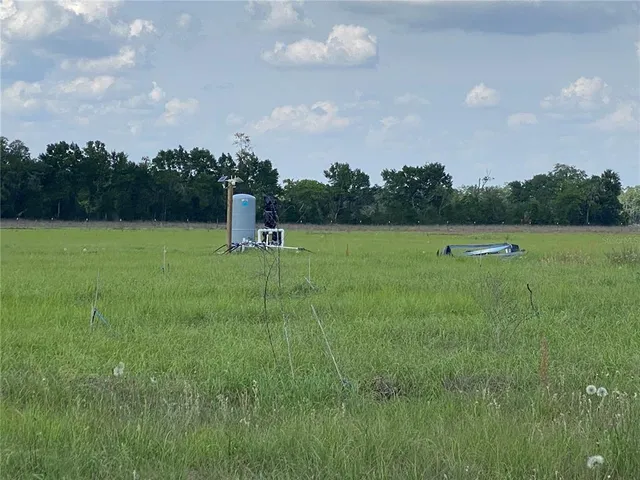 a view of a lake with a big yard