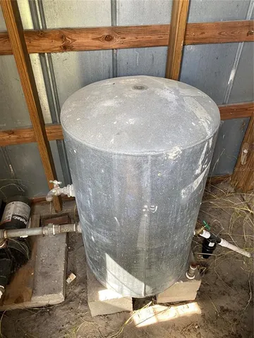 a view of a lake with houses in the back