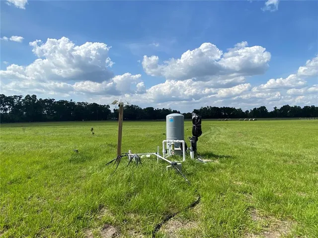 a view of a golf course with a big yard