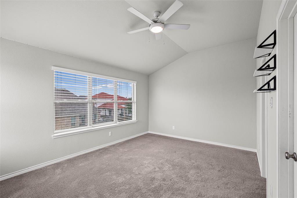 437 Prairie Run Aledo, TX 76008 - Photo 21 of 33 Vaulted ceiling room featuring light gray wall paint, a large multi-pane window with white blinds, and gray carpeting