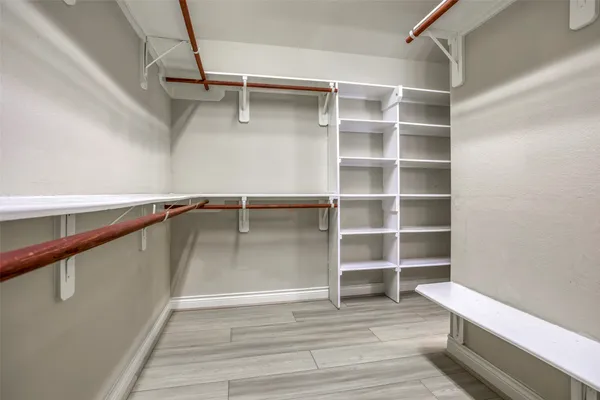 a view of an empty walk in closet
