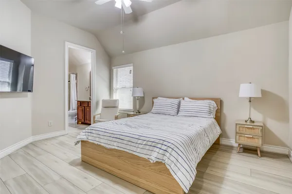 a bedroom with a bed and a table