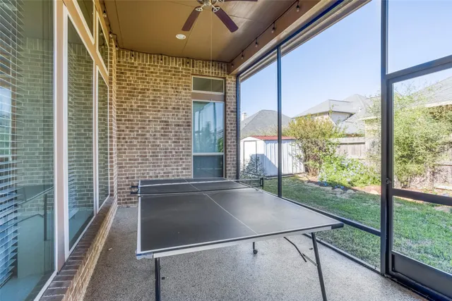 a view of a porch with a floor to ceiling window