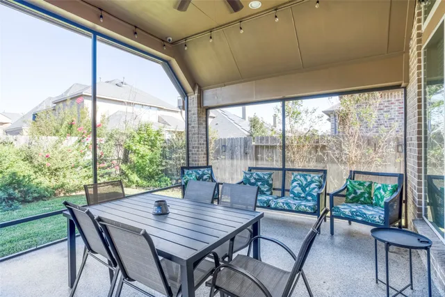a outdoor dining space with furniture and garden view