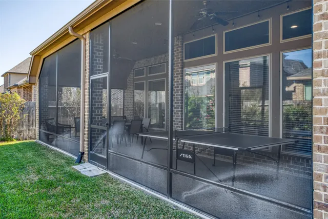 front view of a house with a tree in front of it