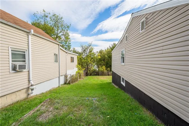 a backyard of a house with lots of green space