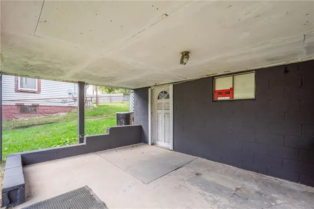 a view of a garden with an outdoor seating space
