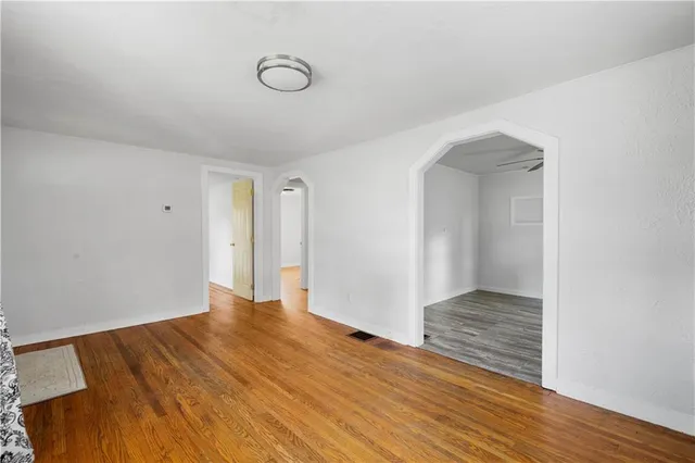 a view of hallway with wooden floor