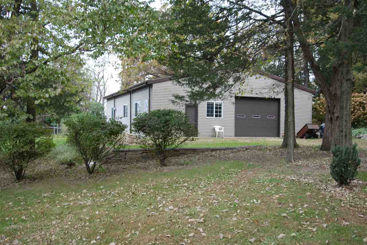 10018 East Campbell Road Davis, IL 61019 - Photo 15 of 15 a view of a house with a yard and tree s