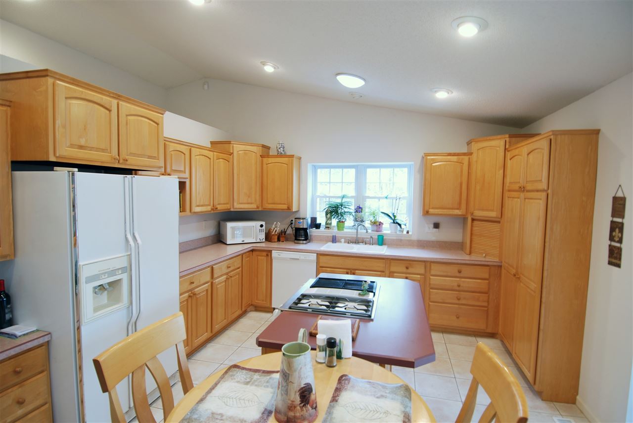 10018 East Campbell Road Davis, IL 61019 - Photo 2 of 15 a kitchen with stainless steel appliances granite countertop a refrigerator and a stove top oven