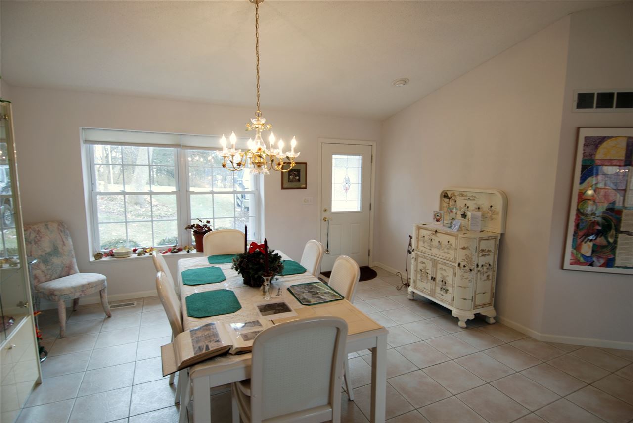 10018 East Campbell Road Davis, IL 61019 - Photo 3 of 15 a living room with furniture and a chandelier