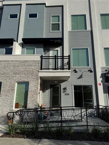 a front view of a house with garage