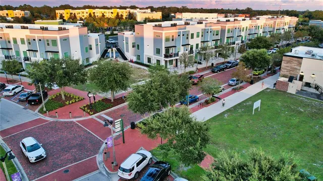 a swimming pool with outdoor seating and garden