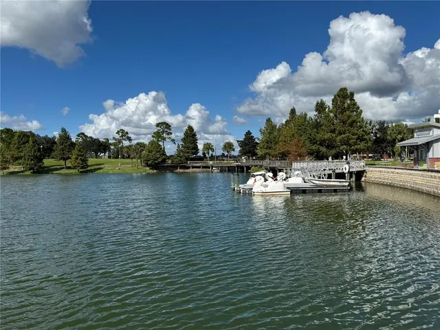 a view of a swimming pool with a yard