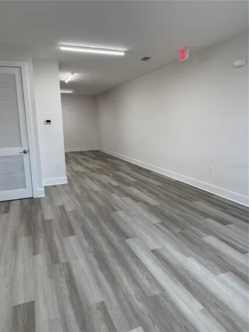 a white toilet sitting next to a shower