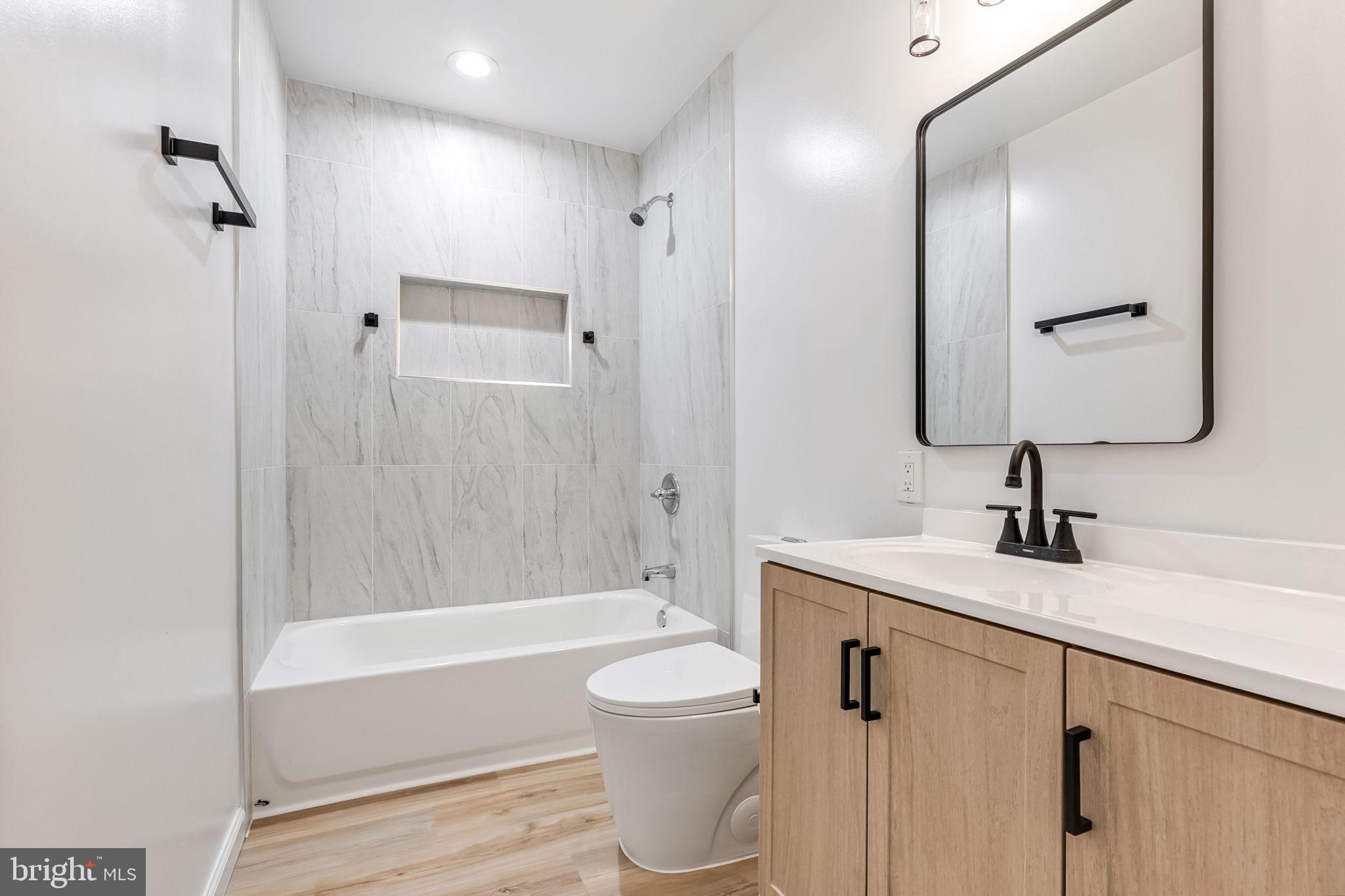 3 Boston Cove Ruther Glen, VA 22546 - Photo 5 of 30 a bathroom with a granite countertop sink toilet a shower and a mirror