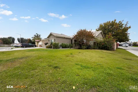 a view of a room with wooden floor and a fireplace