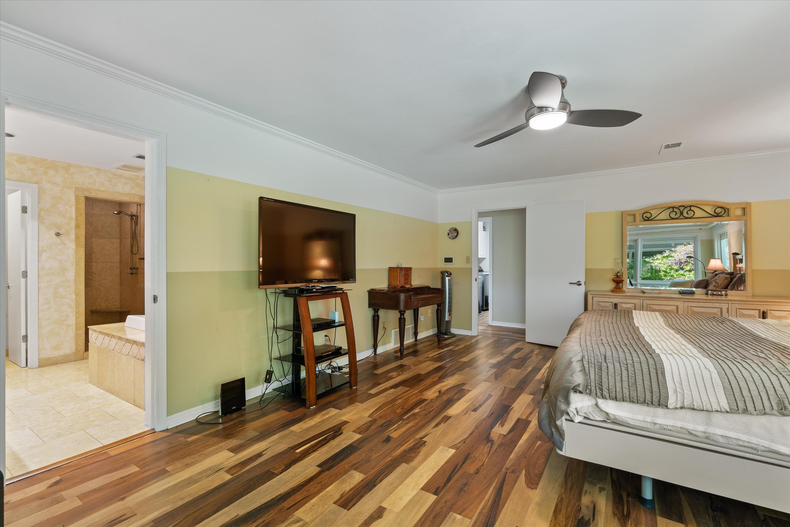 964 Rocky Point Road Memphis, TN 38018 - Photo 16 of 25 a bedroom with a bed and a flat screen tv