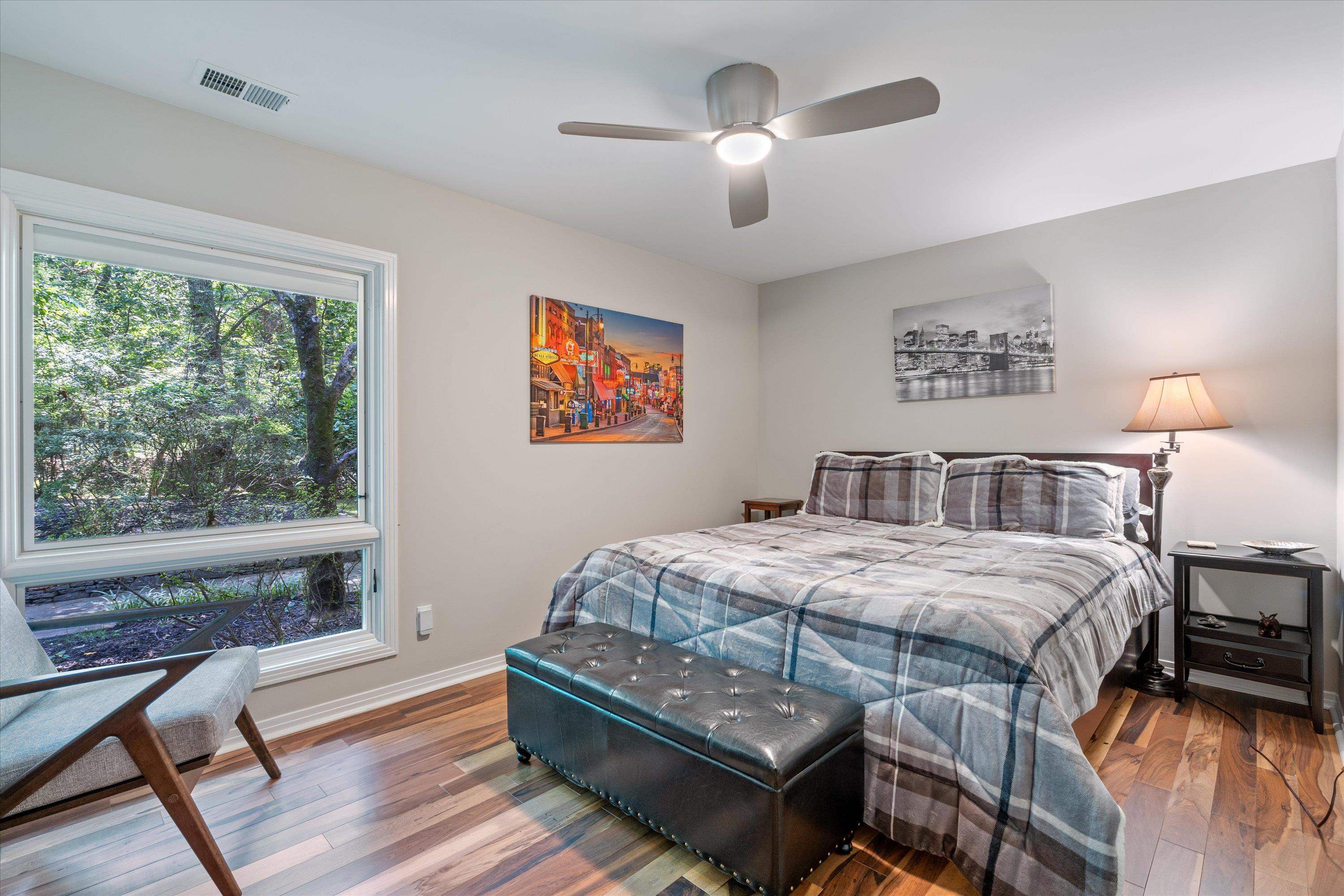 964 Rocky Point Road Memphis, TN 38018 - Photo 19 of 25 a bedroom with a bed and a chandelier