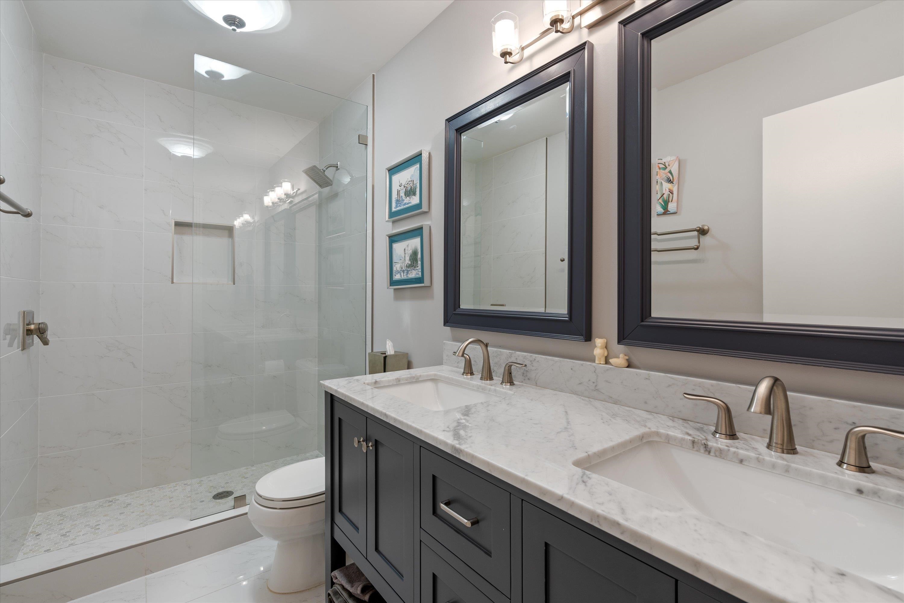 964 Rocky Point Road Memphis, TN 38018 - Photo 22 of 25 a bathroom with a granite countertop sink a toilet and a mirror