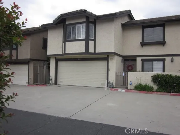 a front view of a house with a garage