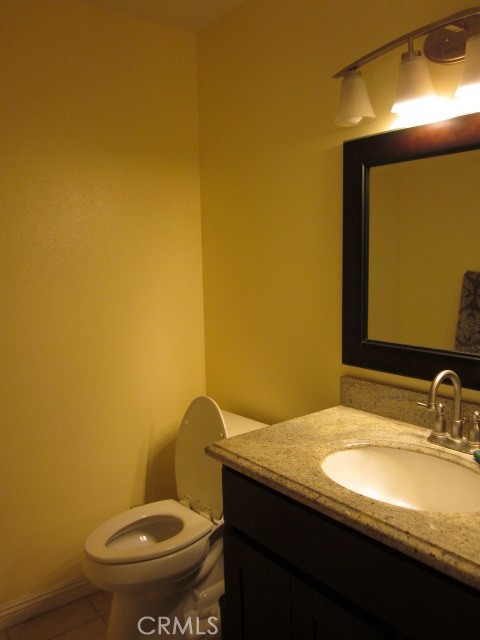 843 Vineyard Avenue Duarte, CA 91010 - Photo 11 of 18 a bathroom with a granite countertop sink and a mirror