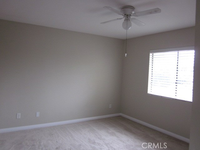 843 Vineyard Avenue Duarte, CA 91010 - Photo 10 of 18 an empty room with a window and a fan