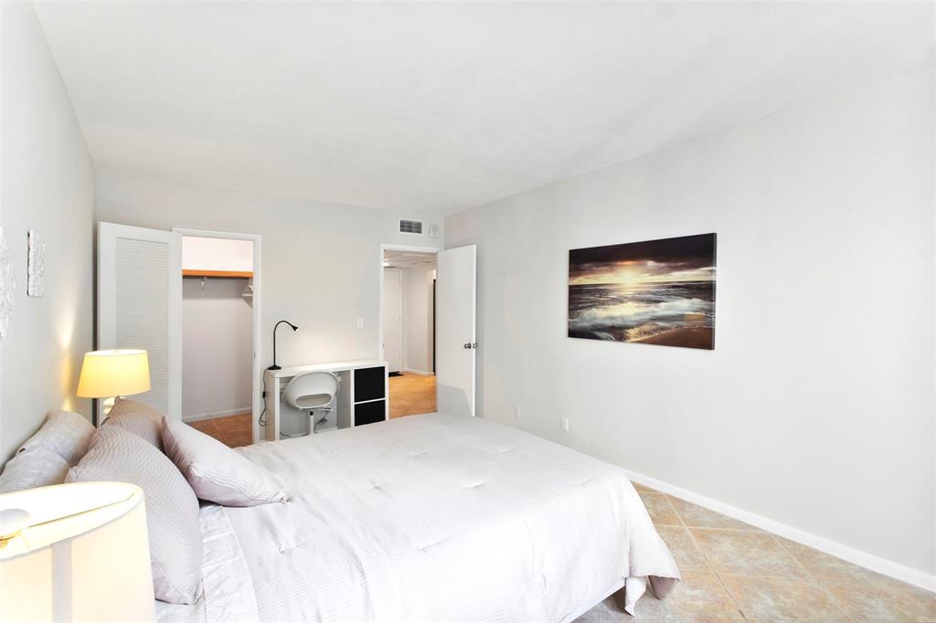 251 South Cypress Road, Unit 127 Pompano Beach, FL 33060 - Photo 11 of 29 a bedroom with a bed and dresser