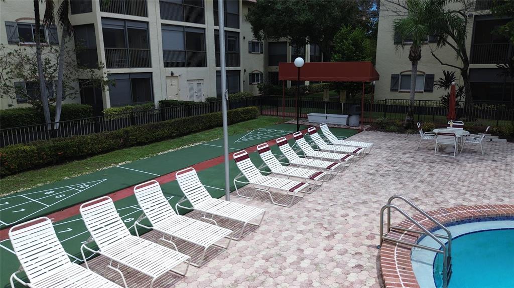 251 South Cypress Road, Unit 127 Pompano Beach, FL 33060 - Photo 19 of 28 Pool and Shuffle Board Area