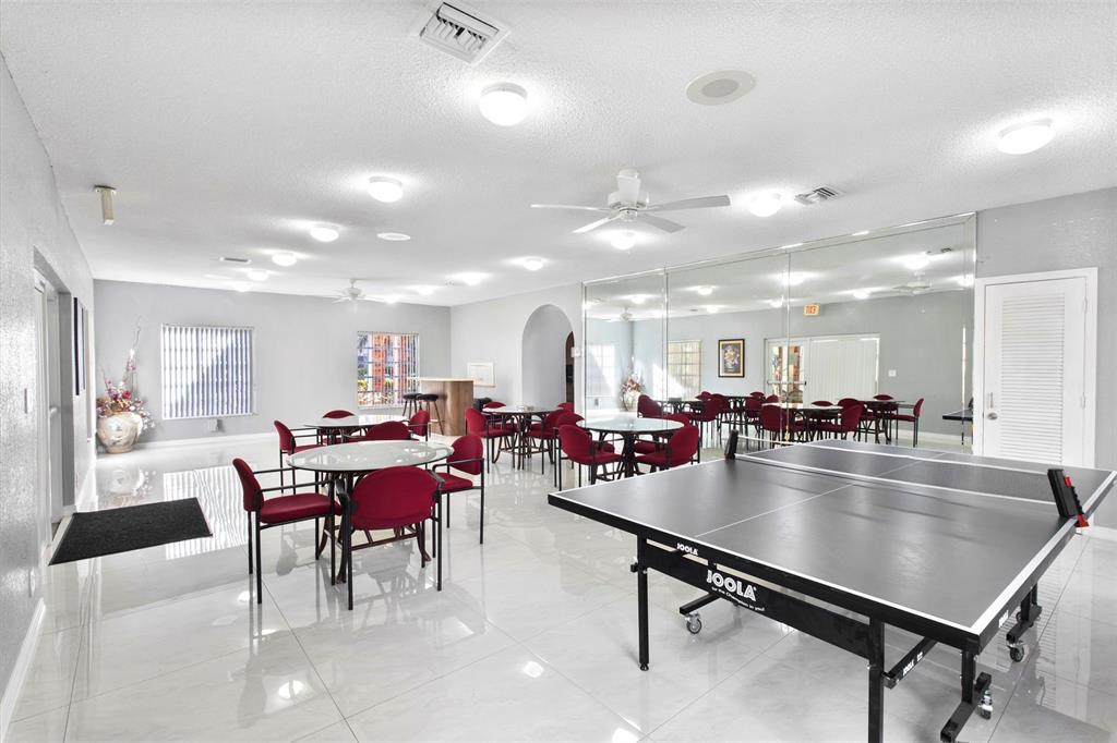 251 South Cypress Road, Unit 127 Pompano Beach, FL 33060 - Photo 20 of 29 a view of a dining room with furniture