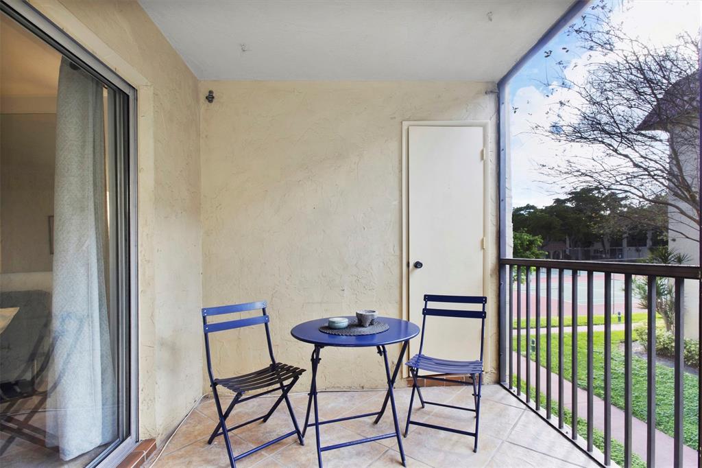 251 South Cypress Road, Unit 127 Pompano Beach, FL 33060 - Photo 23 of 29 a view of a chairs in a balcony