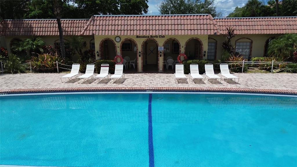251 South Cypress Road, Unit 127 Pompano Beach, FL 33060 - Photo 4 of 28 Pool and Club House Entrance