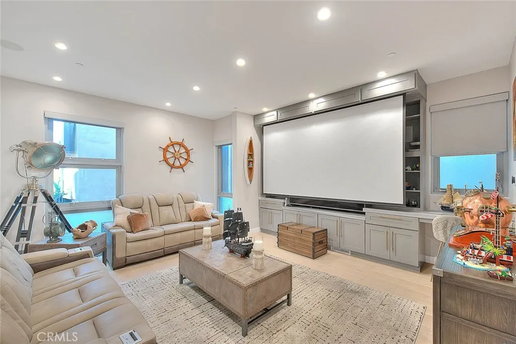 99 Surfside Avenue Surfside, CA 90743 - Photo 17 of 75 a living room with furniture and a flat screen tv