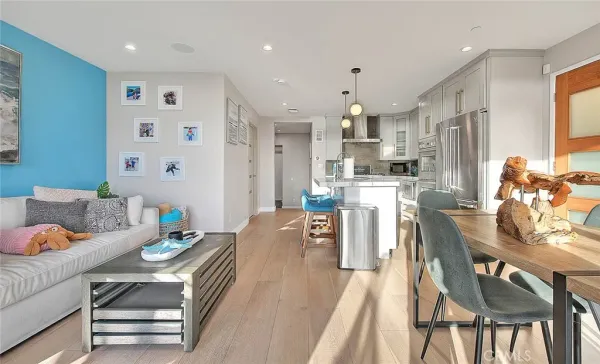 a living room with kitchen island furniture and a kitchen view