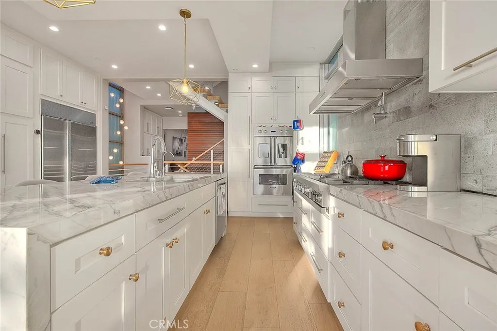 99 Surfside Avenue Surfside, CA 90743 - Photo 22 of 75 a large kitchen with lots of counter space and a sink