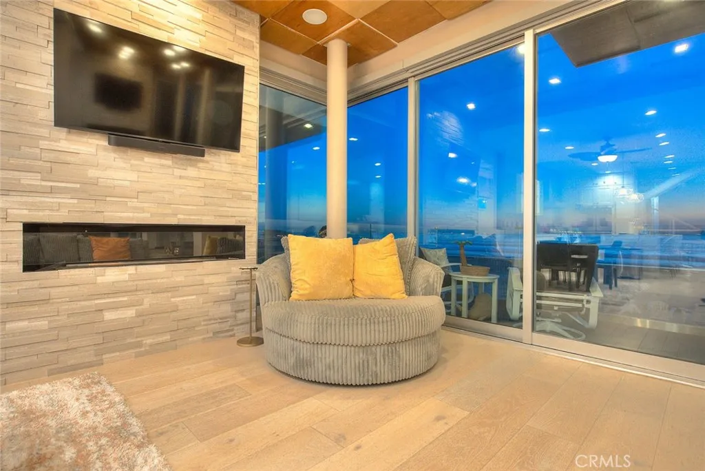 99 Surfside Avenue Surfside, CA 90743 - Photo 28 of 75 a living room with furniture and a flat screen tv