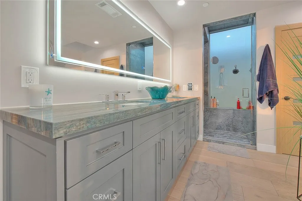 99 Surfside Avenue Surfside, CA 90743 - Photo 39 of 75 a bathroom with a sink and a mirror