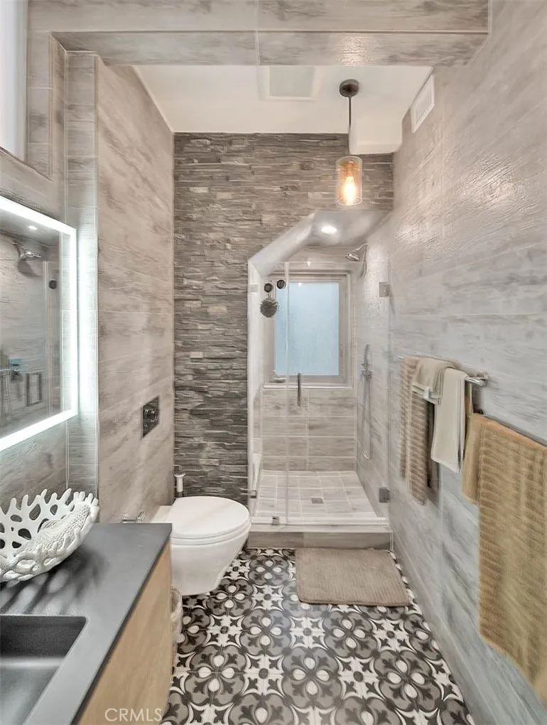 99 Surfside Avenue Surfside, CA 90743 - Photo 44 of 75 a bathroom with a sink a toilet and shower