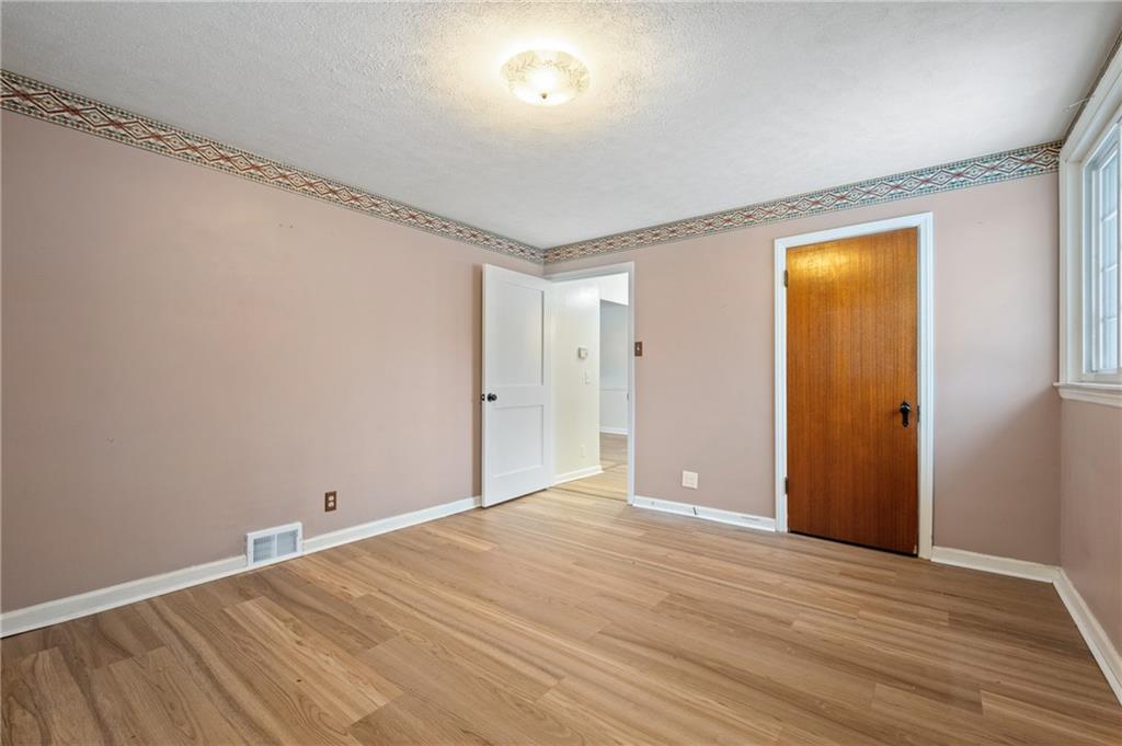 138 Rama Road Beaver Falls, PA 15010 - Photo 13 of 25 a view of empty room with wooden floor