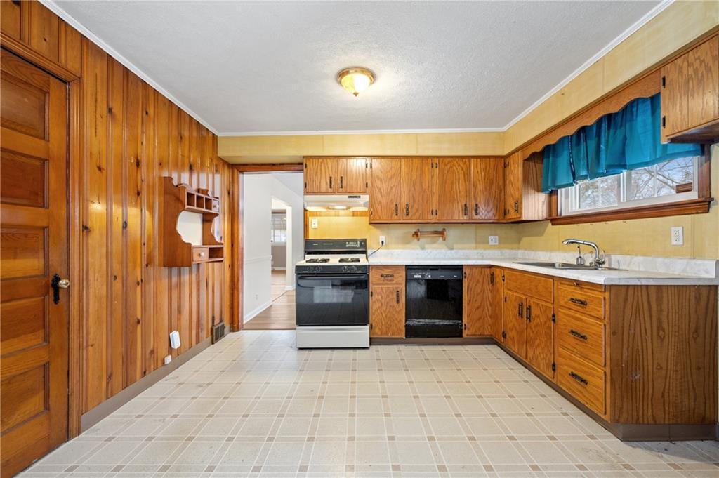 138 Rama Road Beaver Falls, PA 15010 - Photo 3 of 25 a kitchen with stainless steel appliances granite countertop a refrigerator and a stove top oven
