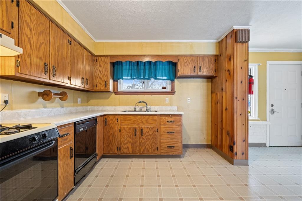 138 Rama Road Beaver Falls, PA 15010 - Photo 8 of 25 a kitchen with stainless steel appliances granite countertop a stove and a refrigerator