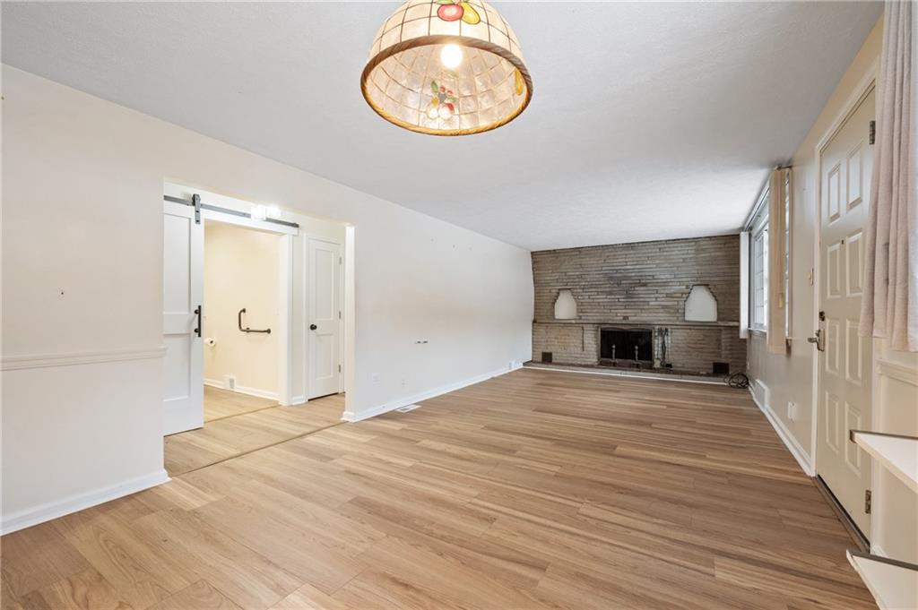138 Rama Road Beaver Falls, PA 15010 - Photo 10 of 25 a view of an empty room with wooden floor and a window