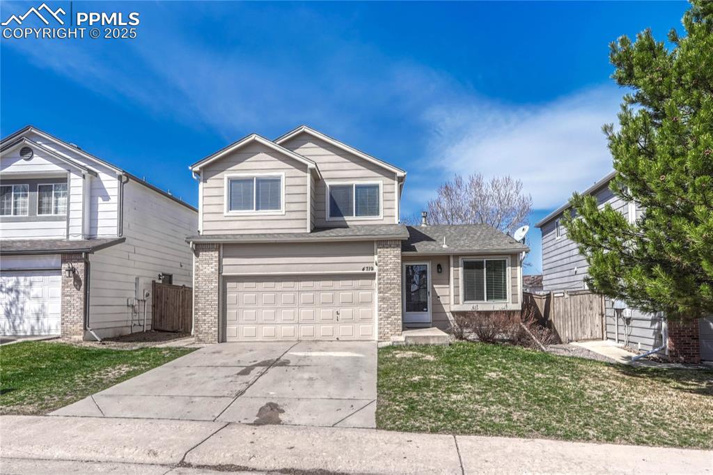Undisclosed Address Castle Rock, CO 80109 - Photo 1 of 11 a front view of a house with a yard