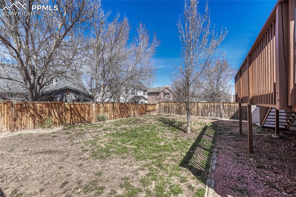 Undisclosed Address Castle Rock, CO 80109 - Photo 8 of 11 a view of backyard with wooden fence