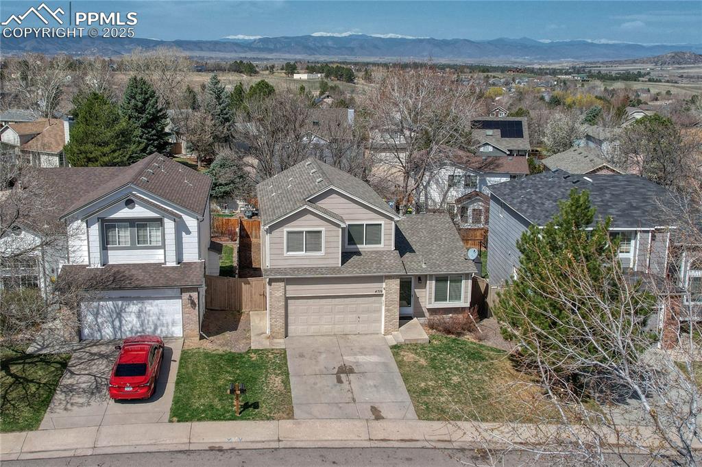 Undisclosed Address Castle Rock, CO 80109 - Photo 9 of 11 a front view of a house with a yard