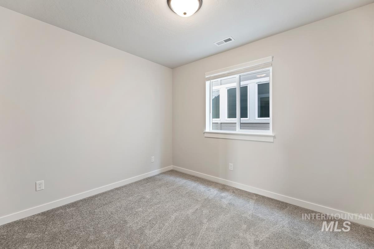 212 East Radiant Ridge Drive Meridian, ID 83642 - Photo 20 of 36 Carpeted empty room featuring baseboards
