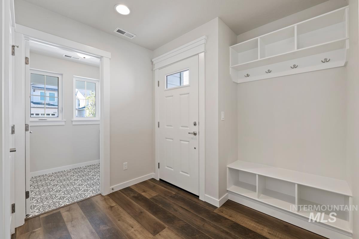 212 East Radiant Ridge Drive Meridian, ID 83642 - Photo 2 of 36 Mudroom featuring plenty of natural light, dark wood finished floors, and recessed lighting