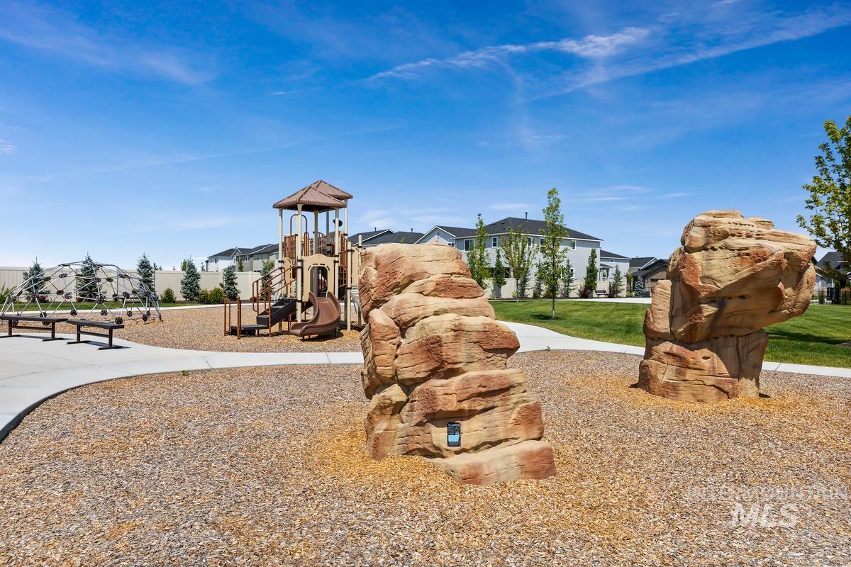 212 East Radiant Ridge Drive Meridian, ID 83642 - Photo 35 of 36 Community jungle gym featuring a residential view and a lawn
